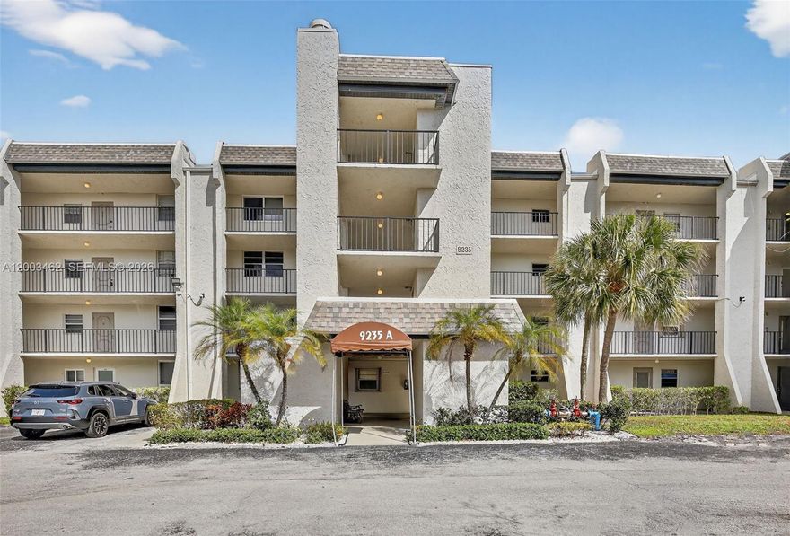 What a magnificent view!!! Lovely condo with upgraded kitchen and stainless steel appliances. Enjoy the Florida sunshine on your screened patio with long lake view. Freshly painted and has new carpet in the bedrooms. Accordion hurricane shutters on all windows. Laundry room and storage room are right across the hall. Food and beverage card for restaurants at Pine Island Ridge Golf and Country Club - $175 annual. Lovely pool area and garden setting. Complex has a new roof 2023.
