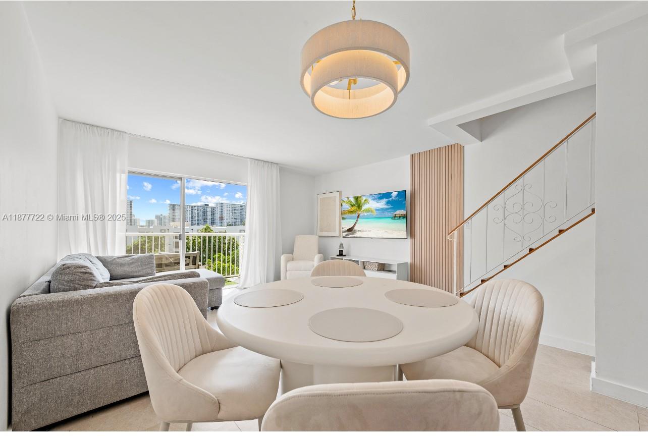 Luxury Redefined – Elegant 2-Story Condo just 1 Block from the Beach! Fully renovated with city-approved permits, this 2BR/1.5BA, two story condo residence blends modern design with elegant finishes. This open-concept living features brand-new electrical & PVC plumbing, quartz countertops, KraftMaid cabinetry, reverse osmosis water system, updated baths, new appliances, and new ceramic floors. Fresh paint, no popcorn ceilings, hard-wired smoke detectors & optimized vents. Balcony showcases partial ocean & skyline views plus the Acqualina Resort. Ample in-unit & building storage, assigned covered parking, in a well-maintained building, steps to dining, cafes, markets, top-rated schools, with the Aventura Mall & Bal Harbour Shops just minutes away - all only steps to the sand!