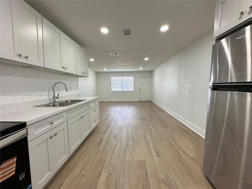 Brand-new, charming 2BR/2BA apartment in Hallandale Beach, meticulously remodeled to embody comfort and style. Every detail feels like home, with new elegant finishes throughout—sparkling granite countertops, brand new, high-end appliances, with beautiful lighting and flooring. The spacious, first-floor corner unit boasts an open, welcoming layout perfect for family gatherings and entertaining, complemented by big rooms and walk-in closets for ample storage. Has a private laundry/utility room with washer & dryer hookup. Unit includes 1 assigned parking space. Situated in a perfect location in a quiet community with easy access to parks, beaches, shopping & dining. This is a true Hallandale gem—a haven of newness, spaciousness & convenience, where every detail makes you feel right at home.