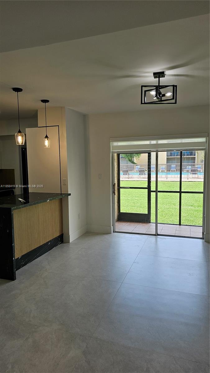 Beautifully remodelled unit on ground floor with view of pool from your terrace. Everythin new in this unit. 2 spacious bedrooms and 2 baths beautiful 48x48 porcelain tiles. Walking distance to Publix and Shopping Center. Walking closets and inside laundry area.