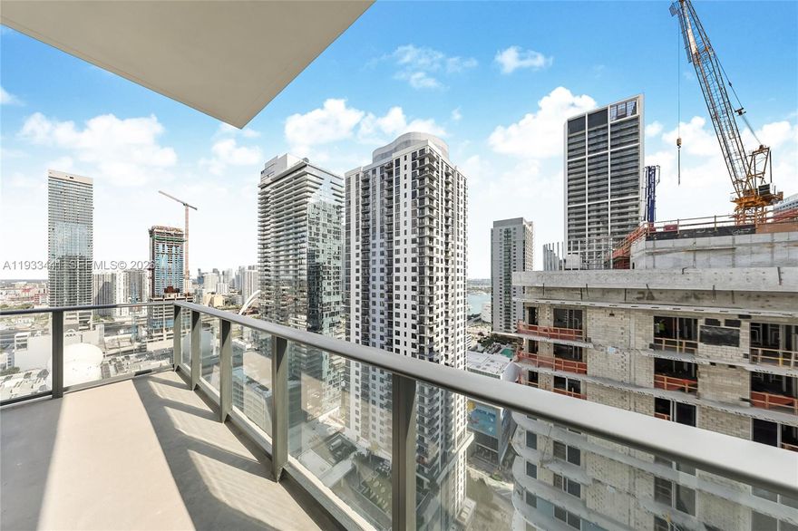 Introducing a newly delivered two-bedroom, two-bathroom corner residence at The Crosby in Miami Worldcenter, designed for upscale urban living in the center of Downtown Miami. Thoughtfully appointed and sold fully furnished, this home offers a spacious, contemporary floor plan highlighted by expansive floor-to-ceiling glass that fills the interior with natural light. Step outside to a private balcony where wide city views and glowing sunsets create an ideal backdrop for everyday living or entertaining. Residents enjoy access to a full suite of high-end amenities, including a resort-style swimming pool, state-of-the-art fitness facilities, spa services, elegant social spaces, and around-the-clock security. The location places you moments from top restaurants, retail, nightlife, and public transportation hubs. Short-term rentals are allowed in accordance with building guidelines, offering flexibility for personal use or income potential. Whether you’re seeking a full-time home, a city
retreat, or a strategic investment, this property delivers comfort, convenience, and long-term value at one of Miami’s most dynamic addresses.