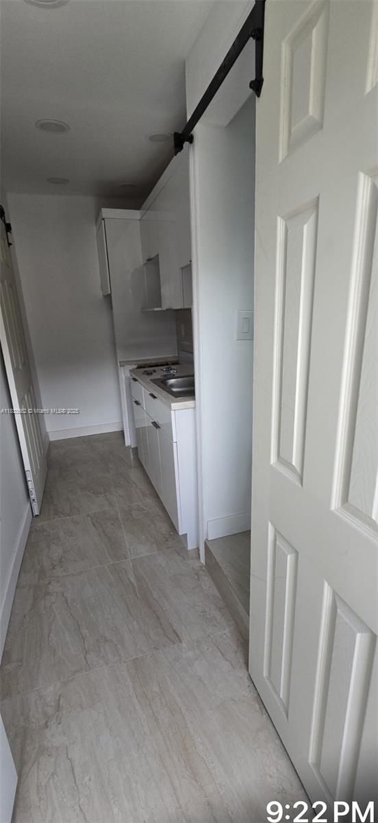 Large efficiency apartment in Miami Gardens , with refrigerator, gas range , microwave, granite counter top, plenty of space with large windows, and a split unit inside the room where you can regulate the temperature .