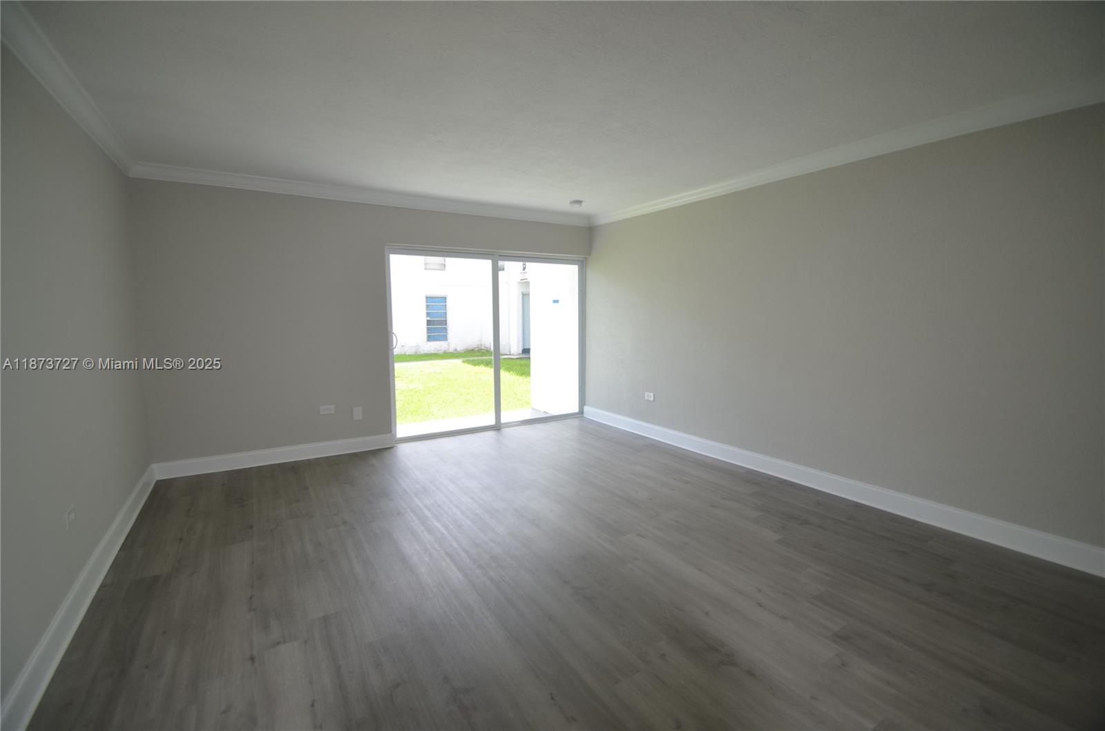 Bright, spacious and completely remodeled, this beautiful ground floor unit in Sunset Palms West offers a backyard and a modern open floor plan. This boutique two-story building features a community pool, one assigned parking space. This home provides easy access to everything you need. Shops and restaurant are conveniently located across the street, and it's close to major expressway and Baptist Hospital South. Just steps away from Miami-Dade County Park (not part of the community), where you'll enjoy tennis courts, children's playground, basketball courts, racquetball courts and baseball field. Move-in ready and easy to show, don't miss out!