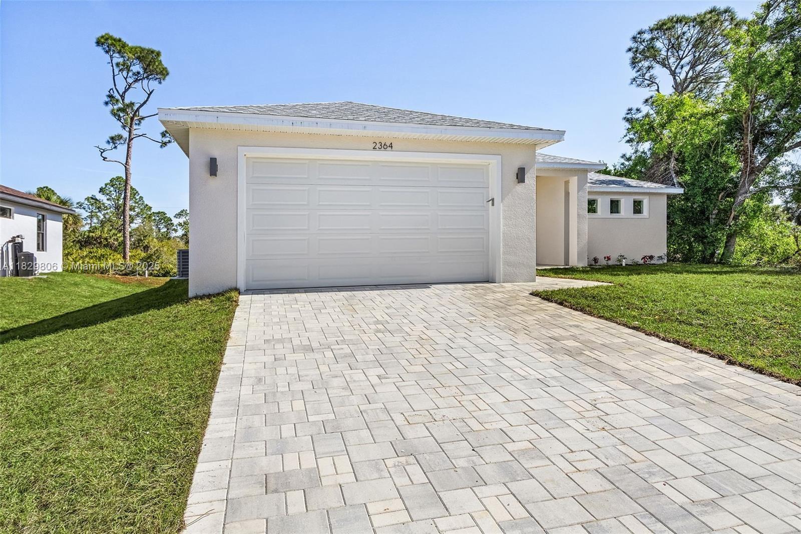 One or more photo(s) has been virtually staged. Move-in ready! This 3-bedroom, 2-bathroom, 1,610 SF living area home, located in North Port offers a modern and free flowing design adorned with luxury finishes. Enhanced with high ceilings and large high-end energy efficient impact windows, the interior features an open-concept living room that provides additional space for your dining and entertaining needs. The kitchen features stainless steel Samsung appliances, quartz countertops, and an oversized island. Enjoy a master suite with a walk-in closet and a double vanity bathroom. The beautiful area of North Port offers residents a premier location with easy access to a multitude of water recreation opportunities, plus easy access to the Gulf of Mexico’s best beaches.