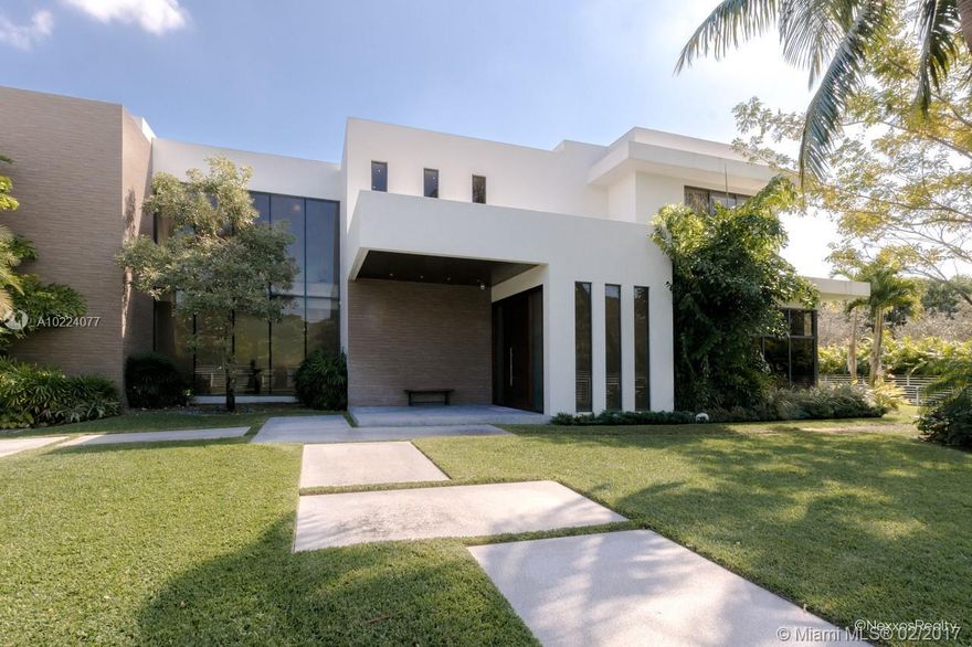 Extraordinary masterpiece in the heart of Pinecrest! This custom designed modern estate spans a generous 9,855 sqft and includes 9 Bedrooms and 9.5 Bathrooms, exceptional craftsmanship with designer interior finishes, dramatic floor to ceiling windows, separate guest quarters, family friendly floorplan blending indoor and outdoor spaces, gourmet kitchen, ample entertaining spaces, amazing BBQ area overlooking the grand pool. Amazing Pinecrest estate!