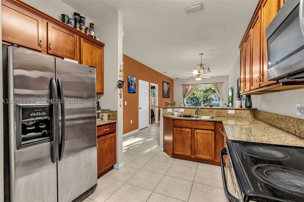 Photo of 1810 SW 91st Ave, Miramar, FL 33025 (MLS # A12071243)