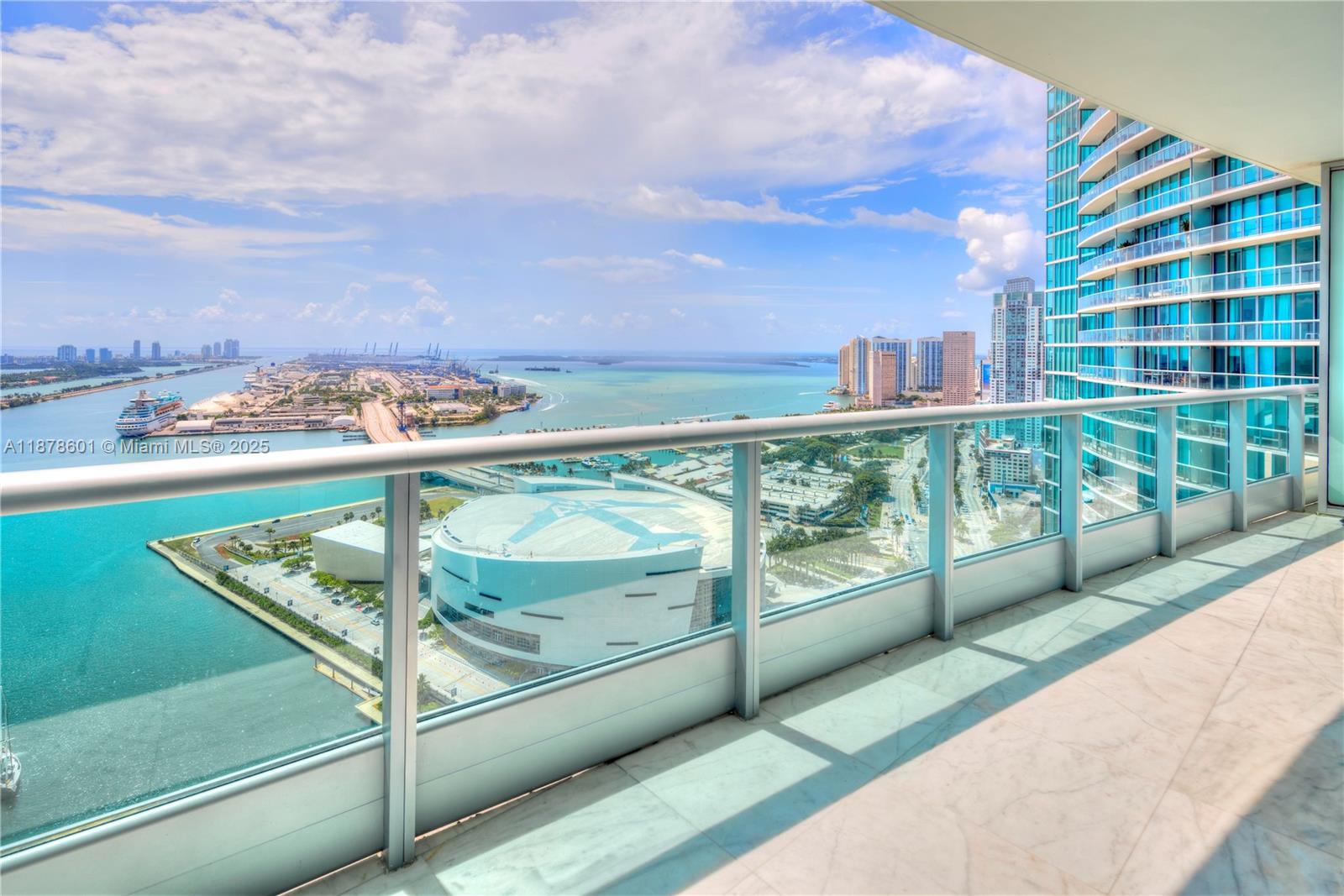 1,006 sq/ft 1 Bed + DEN, 2 Full Bath condo w/direct bay & ocean views. Expansive floor plan, Carrara marble flooring & floor-to-ceiling glass windows. Modern kitchen w/marble countertops & Sub-Zero/Miele appliances. Spa-like master bath w/glass-enclosed shower & soaking tub. Custom walk-in closet. Oversized terrace w/stunning views of Biscayne Bay & Miami Beach skyline. Washer/Dryer in unit. Amenities: 2 pools, private theater, fitness center & full-service spa.
