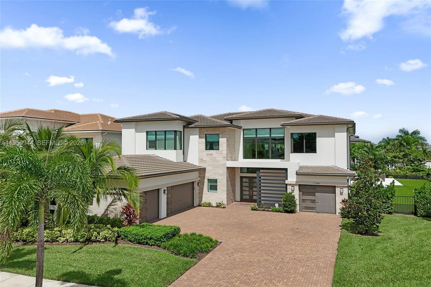 Impeccable custom-built home in Boca Bridges. One of the biggest lots (corner lot) in the entire neighborhood at over 20 thousand square feet (0.47 acres). Entire interior is custom - owners bought the shell from GL and even ripped out the kitchen before installing everything with high end, custom finishes. Resort style backyard: 260k giant heated pool, all grass was taken out for turf, fully grown in clusia plants to provide privacy on all sides, bottom of fence protected from toads and insects with Toad Buster's high end protective gate - truly a must see backyard! High end wood flooring throughout, custom imported stone counters and kitchen. Amazing epoxy flooring in both garages including custom built cabinets and shelves. Drapes on all windows and sliding doors including the huge upstairs entrance window, and master bedroom has hotel-style mechanical drapery for a true luxurious feel. This is a true one of a kind home AND lot in one of the most desirable neighborhoods in all of Boca Raton!
