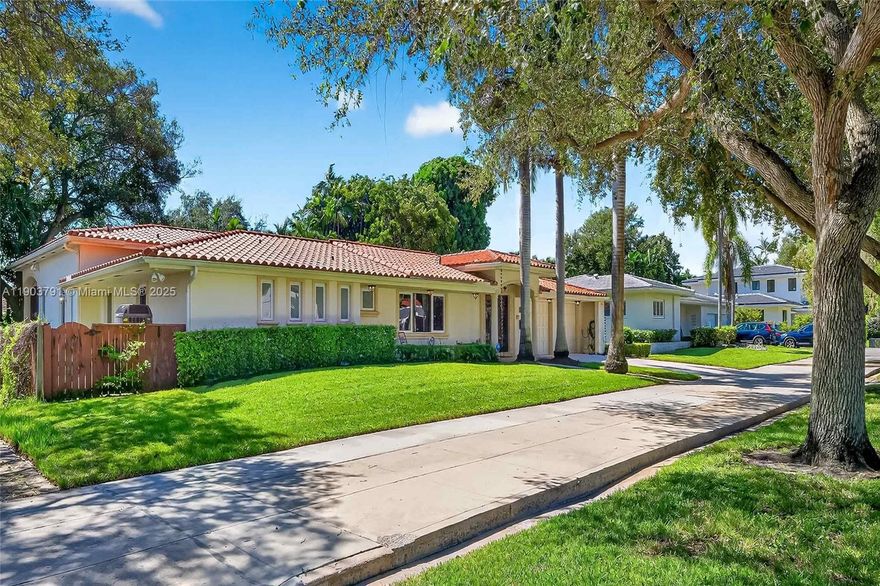 Spacious 4-bedroom, 3.5-bath home on a quiet, tree-lined street in Miami Shores. A welcoming foyer opens to a dramatic, oversized living area with an open layout that offers natural flow and defined spaces for relaxing or entertaining. The expansive chef’s kitchen overlooks the pool and backyard with exceptional storage, generous prep space, and casual seating. The primary suite features two walk-in closets, extra closets, and a spa-style bath with double vanities, water closet, and oversized shower. Highlights include high ceilings, impact windows and doors, updated plumbing and electrical, natural gas, and a full-house generator. Enjoy a heated pool, large covered outdoor entertaining area, attached 1.5-car garage, and excellent off-street parking.