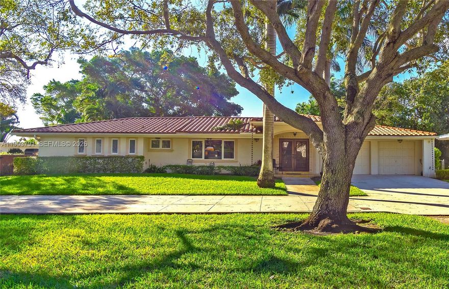 New to market at $2,770,000. Spacious 4-bedroom, 3.5-bath home on a quiet, tree-lined street in Miami Shores. High ceilings and a dramatic oversized living area offer open flow and defined spaces for relaxing or entertaining. The expansive chef’s kitchen overlooks the pool and backyard with exceptional storage, generous prep space, casual seating, gas range. The primary suite features two walk-in closets and a spa-style bath with Italian stone walk-in shower with built-in seating, double vanities, and private water closet. Seven walk-in closets throughout, six with Elfa systems, provide abundant storage. Enjoy a heated salt-chlorinated pool, large covered outdoor entertaining area, spacious laundry room with cabinetry. All impact windows and doors, updated plumbing and electrical, natural gas, and two gas tankless water heaters, three Trane AC systems, full-house Generac generator, security with cameras and video entry. Attached 1.5-car garage, and ample double driveway parking.