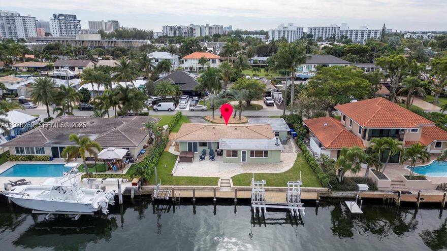 This may be your last chance to own 80Ft of pristine waterfront at this PRICE!!! Enjoy NO BRIDGES AT ALL in between your dock and the Hillsboro Inlet - You can be on the ocean in less time than it takes to put on your bathing suit!!! Live the ultimate waterfront lifestyle with paddle boarding, kayaking, or jet-skiing right from your dock, or unwind in the 6-person Hot Tub. Boaters will appreciate the 45,000-lb heavy-duty boat lift, plus a separate Jet Ski Lift. Additional features and upgrades include: newer roof, impact windows and doors, new PVC Water Main Supply & PVC Sewer Line. Upgraded Electrical System with 100 AMPS at the dock. Updated Kitchen & Bathrooms, whole-house water filtration system, two-car Garage and circular driveway. Beautiful curb appeal and a quiet cut-de-sac location complete this exceptional property.