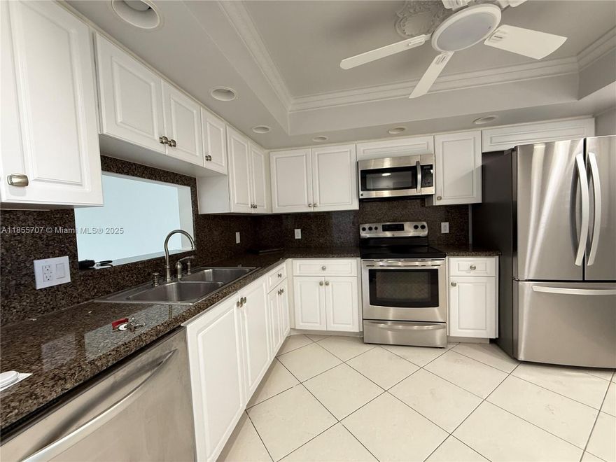 Charming Penthouse of 1,421 sq ft featuring walk-in closets, a fully equipped kitchen with stainless steel appliances, and abundant natural light. Bathrooms fully remodeled with modern finishes and spacious drawers in the primary bath. Screened balcony with room for outdoor furniture, perfect for enjoying spectacular sunsets overlooking the pool, lake, and golf course. Prime location: 16 min from the beach, 15 min from the airport, 5 min from Downtown Lake Worth, close to Downtown West Palm Beach, next to John F. Kennedy Hospital, near restaurants, malls, plazas, and top-rated schools. Move-in ready in a gated community with security, covered assigned parking, and guest parking.