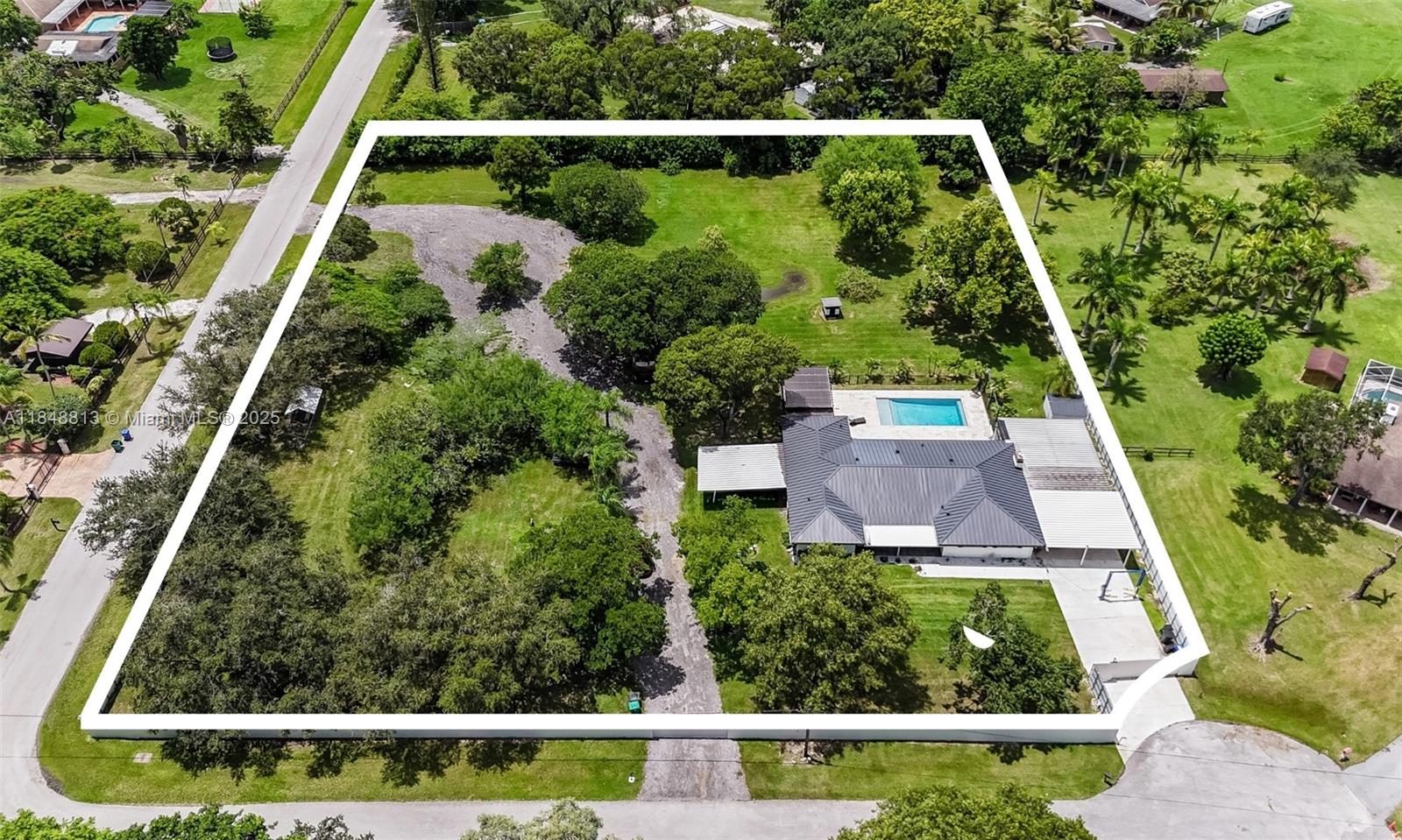 Fully updated, and privately nestled on 2.04 acres in Southwest Ranches. Located on a quiet cul-de-sac surrounded by mature trees, this modern home features beautiful marble flooring throughout, a new metal roof (2021), impact windows & doors, and individual ductless mini-split AC units in each room. Enjoy your resort-style backyard featuring a new saltwater pool (2022), pergola, and custom-built outdoor kitchen, perfect for entertaining. Customize your property with a barn, stables, or guest house and build your dream equestrian estate, the possibilities are endless. NO HOA! Enjoy peaceful living in one of Southwest Ranches’ most desirable locations. Available for lease! Schedule your showing today!