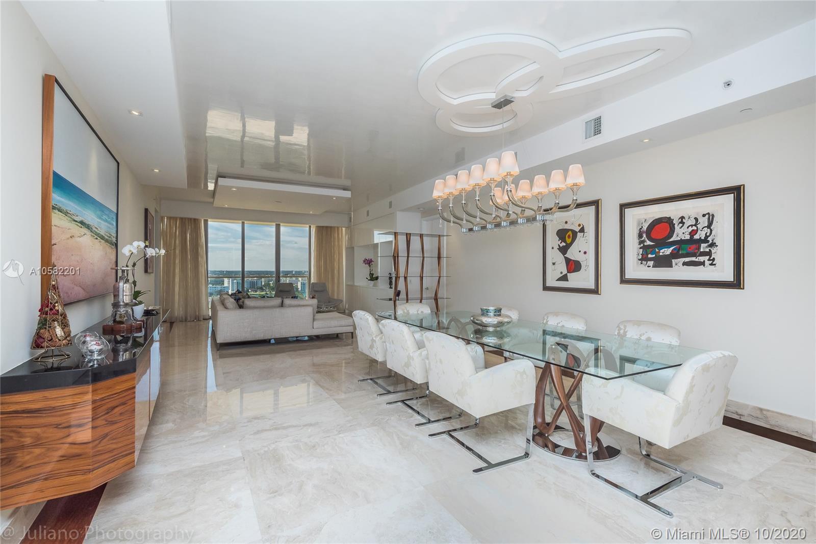 PROFESSIONALLY DESIGNED SHOWCASE! SHOWS LIKE A MODEL! Luxury finishes throughout this DIRECT oceanfront gem. Panoramic vistas of the ocean, city, and bay views. No expense has been spared from this beautifully executed condo. A TRUE DELIGHT! The endless list of luxuries includes marble floors, drop ceilings, motorized blinds, and a customized floor plan for more expansive luxury living. Resort living at its best.
Built-in wine cellar in the kitchen. 14000 SF Exclusive access to St Regis amenities. Concierge and Butler on staff, 24-hour dining service. Remede Spa onsite. Walking distance to Luxury Fashion Shopping at Bal Harbour Shops, exquisite collection of designer boutiques and restaurants in a tropical garden setting. An internationally renowned shopping destination!