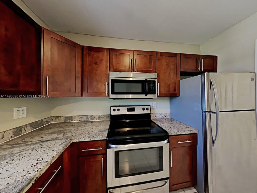 Photo of 285 NW 7th Ct, Deerfield Beach, FL 33441 (MLS # A11498398)