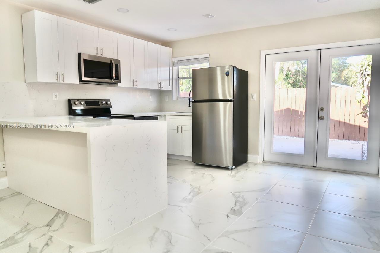 Welcome 112 SW 20th Ave, a beautifully updated 2/2unit in a charming duplex, with a fully remodeled kitchen with modern cabinetry, stainless appliances, and sleek finishes perfect for entertaining and relaxing this home sharing access to a sparkling pool giving of a resort style experience located in desirable neighborhood just minutes from the beach highways las olas park and restaurants laundry area is conveniently located for your use