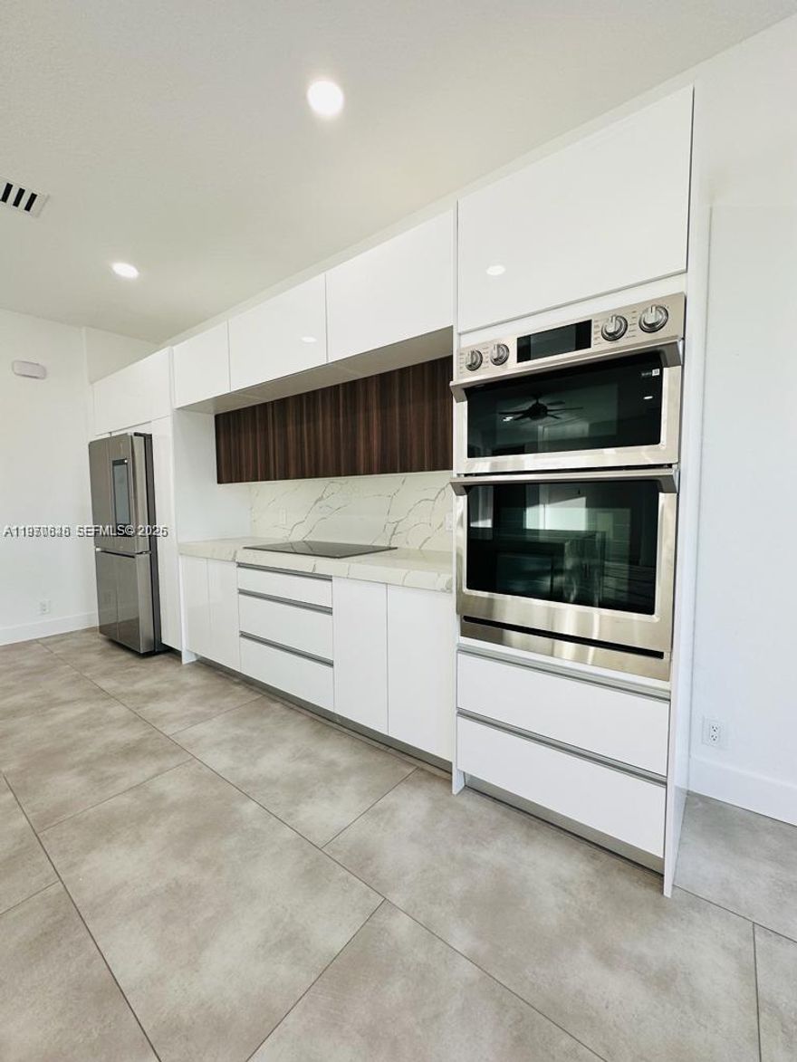 Beautiful REMODELED 6 bedrooms, 5 bathrooms and 4 car garage house located at the prestigious community of Weston Hills Country Club. Come and enjoy the astonishing sunsets from the pool side, while viewing the peaceful canal. Fenced backyard. Top of the line finishes all around the home, starting from its modern kitchen with all new cabinets, calacatta quartz countertops and stainless-steel appliances. Modern ceramic tiles all throughout the first floor and stairs, plus laminated floors upstairs. Contemporary bathrooms. Built in closet plus laundry room upstairs. This community offers a variety of amenities, including a golf course, tennis courts, a clubhouse, and a community pool. Weston Hills is also home to some of the best schools in Broward County. HURRY IT WON’T LAST!