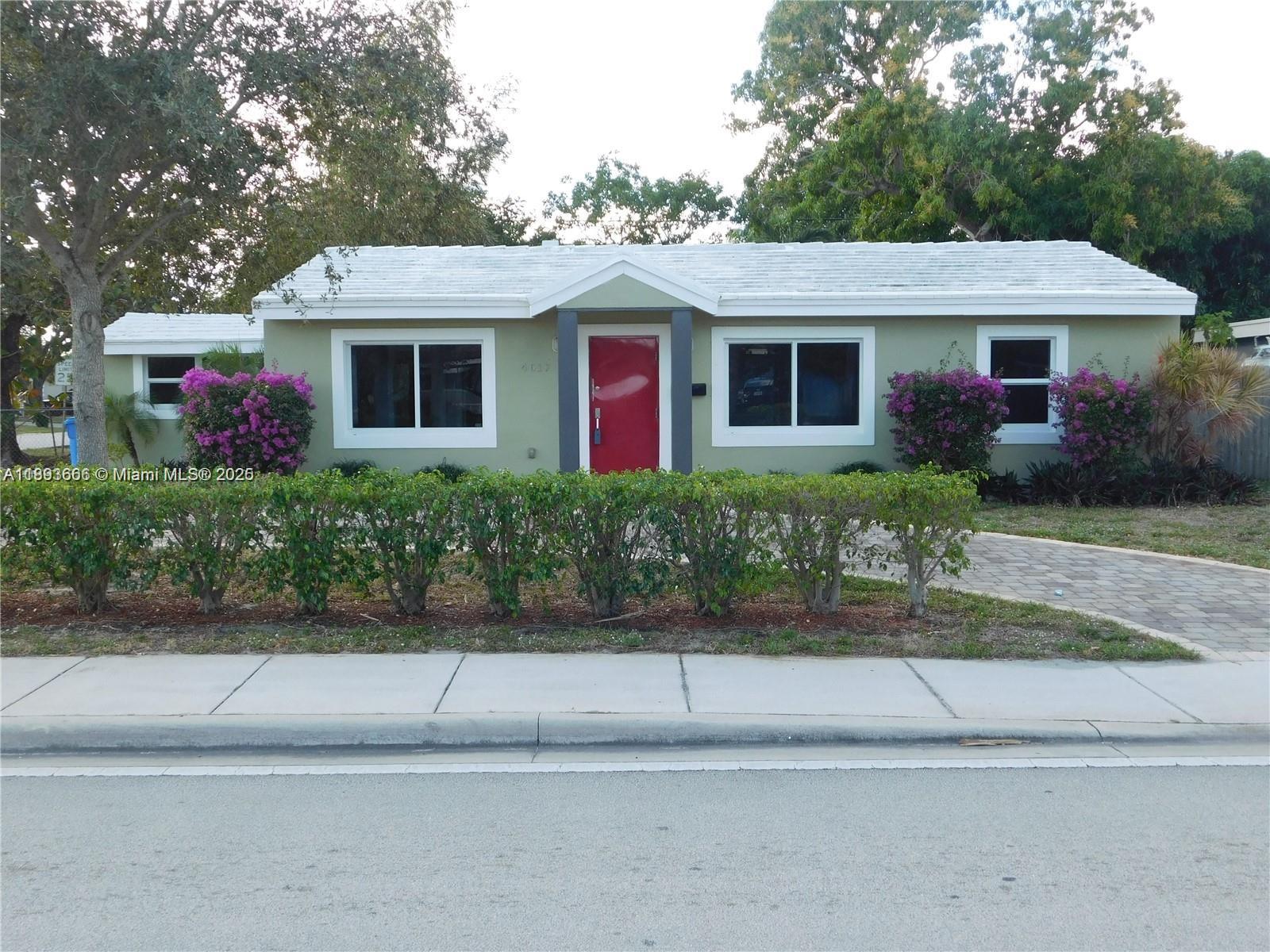 Welcome to this modern and contemporary complete conversion of a 3-bed 2 bath Florida home. Magnificent 16 feet cathedral ceilings with exposed wood make this property unique and charming. Extremely bright house with numerous enlarged impact glass windows produce an outdoor feeling to this exquisite home. Circular driveway with pavers and numerous fruit trees create a lovely shaded fenced-in backyard with room for a pool, perfect for pets or kids. Other great features include beautiful porcelain flooring, European style open kitchen. Green house with high efficiency tankless hot water heater, high efficiency AC and upgraded insulation. Super-fast internet available. Extremely close to Wilton Manors, minutes from Ft. Lauderdale beaches, downtown, airport, and many fine restaurants.