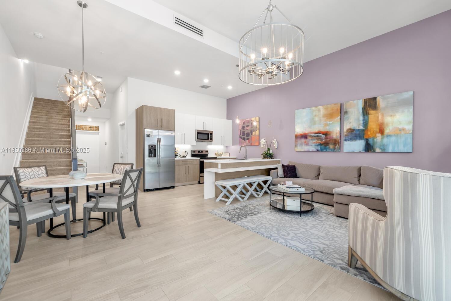 Beautifully maintained 3-bedroom, 2.5-bath townhome located in the highly sought-after gated community of Strata at Plantation. Built in 2019, this residence combines modern design with thoughtful details throughout. The gourmet kitchen boasts a two-tier countertop, stainless steel appliances, and opens seamlessly to the bright and spacious living and dining areas. Upstairs, the primary suite offers a walk-in closet and spa-inspired bath, while two additional bedrooms provide comfort and flexibility for family, guests, or a home office. Additional features include tile flooring, impact windows and garage door, LED lighting, and a private balcony. Residents of Strata enjoy resort-style amenities including a pool, fitness center, dog park, and clubhouse—all in the heart of Plantation.