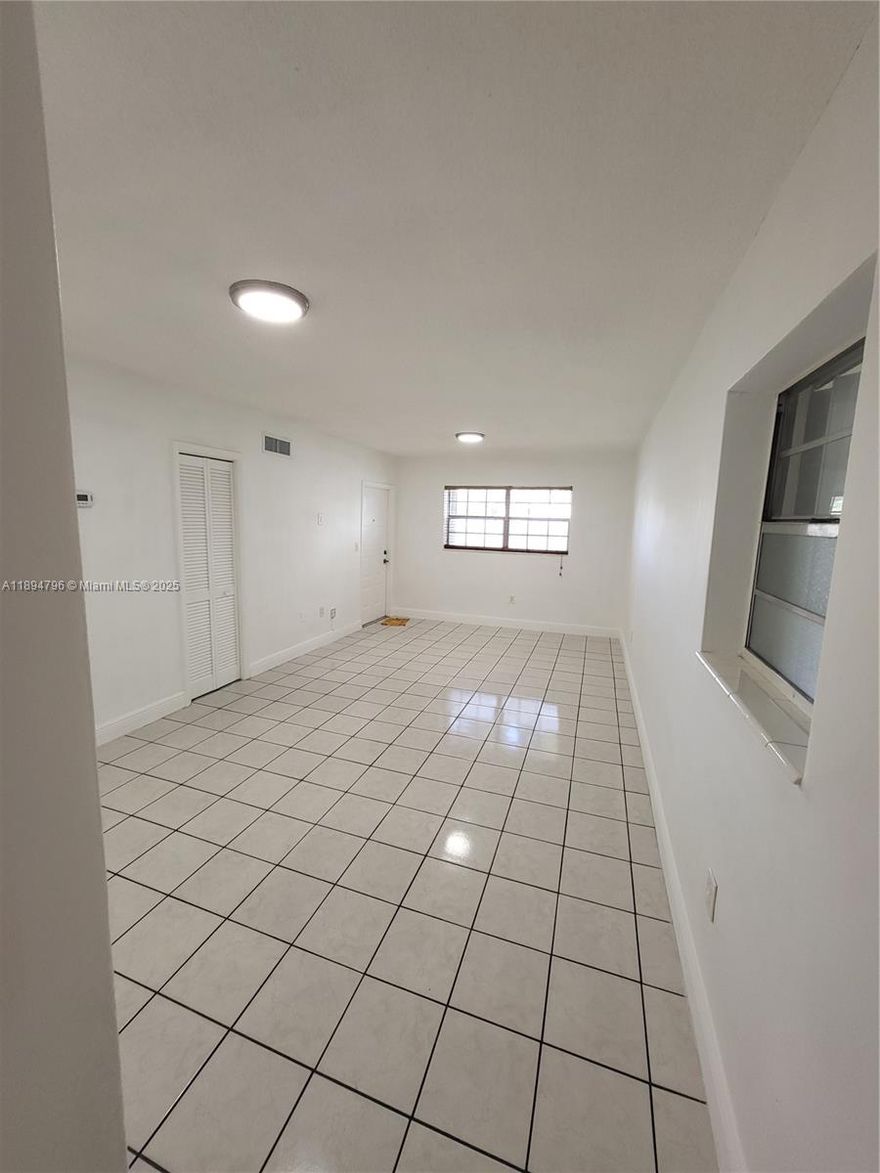 Centrally located ground floor 2 bedrooms 1 bath apartment with a small private patio, terrazzo floors, central a/c and accordion shutters. Fast approval