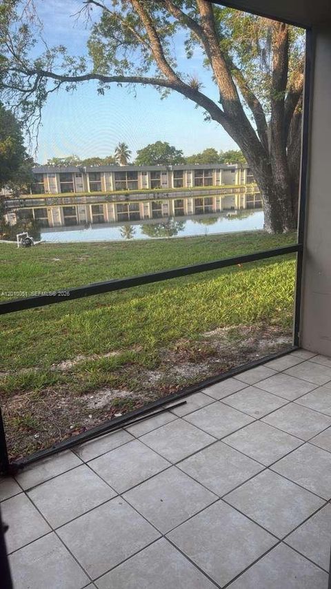 Photo of 7910 N Colony Cir N #101, Tamarac, FL 33321 (MLS # A12010051)