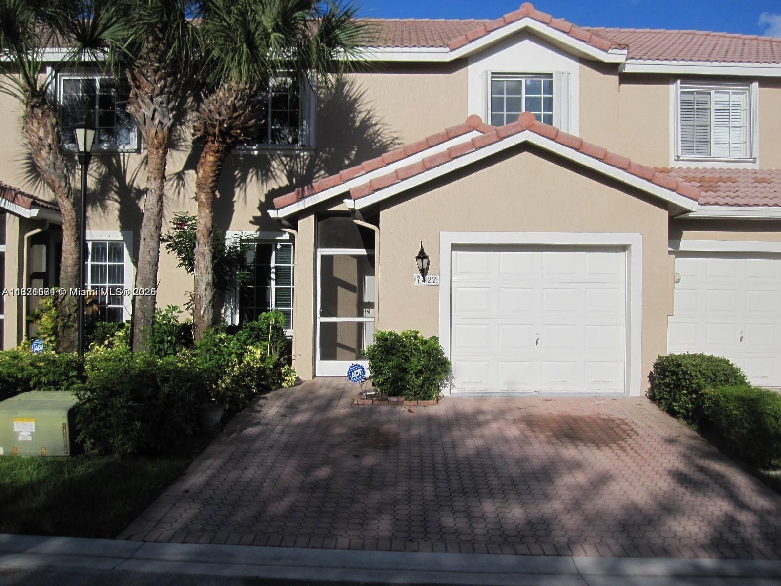 THIS SPACIOUS TOWNHOME FEATURES 3 LARGE BEDROOMS WITH THE MASTER BEDROOM ON THE FIRST FLOOR PLUS A LOFT AND A OFFICE/DEN. NICE EAT-IN-KITCHEN WITH STAINLESS STEEL APPLIANCES AND QUARTZ COUNTER TOPS, MASTER BATH HAS GRANITE COUNTER. FRESHLY PAINTED AND NEW WOOD FLOORS UPSTAIRS. THIS HOME ALSO FEATURES A FULL SIZE WASHER/DRYER IN UNIT, ADT ALARM SYSTEM, AND ACCORDION HURRICANE SHUTTERS. BEST LOCATION OVERLOOKING THE LAKE. 2 CAR PAVER DRIVEWAY 1 CAR GARAGE AND PLENTY OF GUEST PARKING. GREAT SCHOOLS AND LOCATION