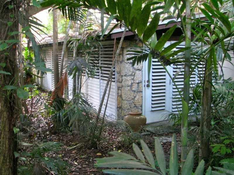 Wonderful handyman's special on huge 11,500 sq ft lot 80 X 144! Classic Florida home is 2,296 sq ft with walls of windows beamed ceiling, terrazzo floors. Separate house outback, pond and coral patio. A great project to renovate or build a dream home. Loc ated in a no flood zone with new homes being built at the end of the street for 2.2 million. Location- Location-Location!