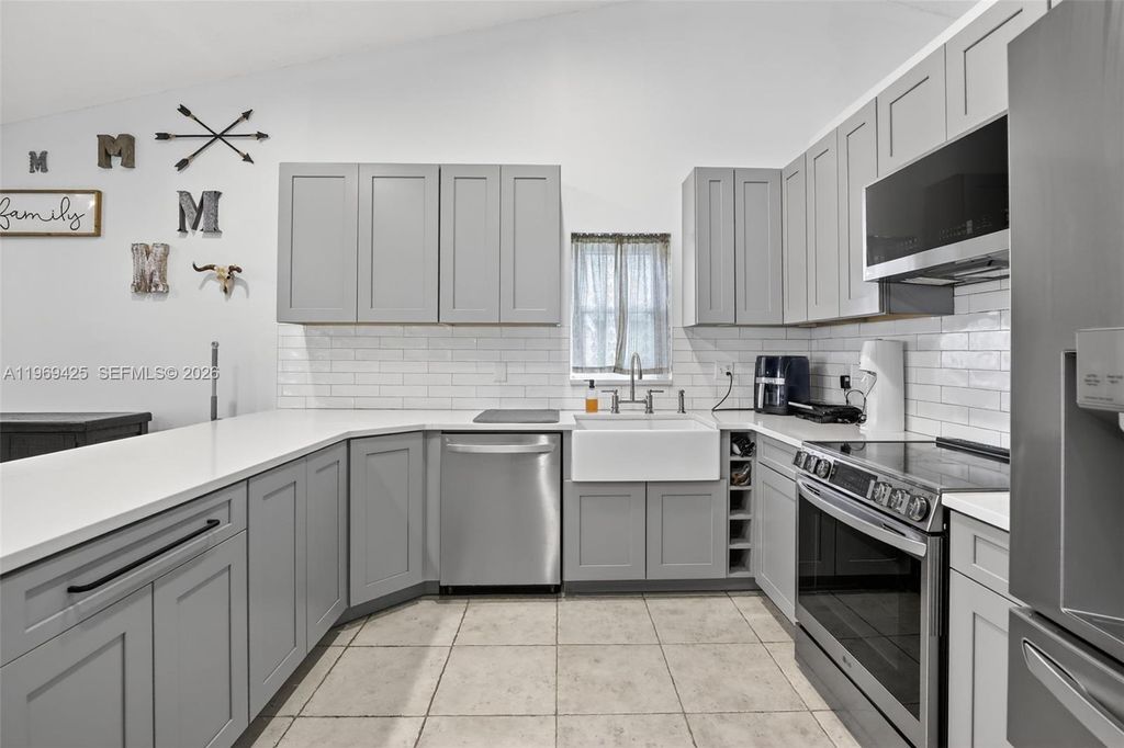 Photo of 9731 NW 32nd Mnr, Sunrise, FL 33351 (MLS # A11969425)