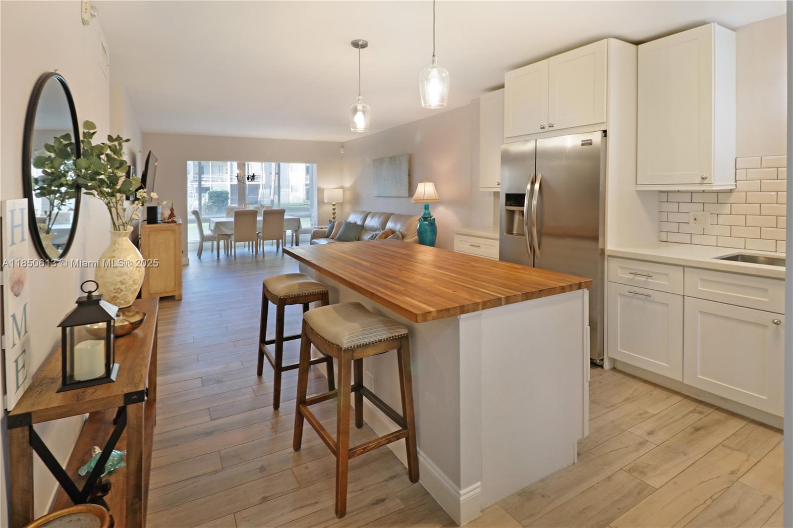 This beautifully renovated, fully furnished 2 bedroom, 2 bathroom first-floor unit in Boca Teeca offers a modern open-concept kitchen featuring a butcher block countertop Island and stainless steel appliances. The patio is enclosed with hurricane-impact windows and offers serene views of the pool and garden area. Beautiful natural light throughout. Conveniently located near I-95, this unit provides easy access to various local attractions, including pristine beaches, restaurants, Town Center Mall, FAU, Downtown Mizner Park, & Gumbo Limbo Nature Park. A short drive takes you to the vibrant atmosphere of Downtown Delray Beach. Cable and Wi-Fi are included for your convenience. Unit available on a seasonal basis from January 5, 2026, to August 5, 2026. Somewhat flexible on rental duration.