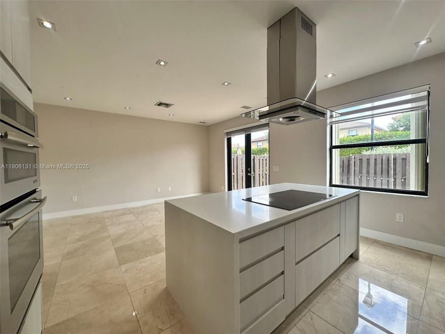 Spectacular corner townhouse for rent in Doral! This elegant home features beautiful marble floors, painted walls, and impact windows with zebra blinds. Enjoy a spacious open kitchen with quartz countertops, cooking island, and smart appliances. Upstairs laundry room for convenience. Private fenced patio with access to visitor parking, glass stair railing, one-car garage plus driveway for two cars. Resort-style amenities include pool, gym, tennis, basketball, BBQ area, playground, and more. Conveniently located near top schools, shopping centers, restaurants, and major highways—offering the perfect blend of luxury and location.