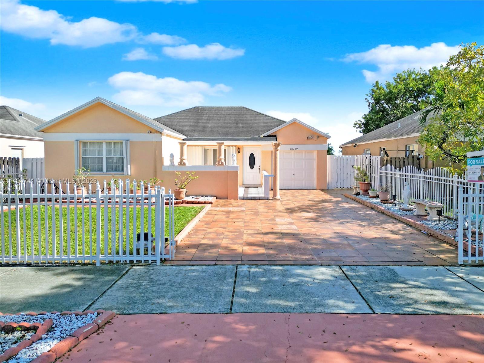 Inviting 3 bedroom, 2 bathroom & den residence nestled in the heart of Miami Gardens. This lovely home boasts an updated kitchen and bathrooms, an open-concept layout for comfortable living, and a backyard that sits on the water perfect for relaxation and entertaining. Enjoy the convenience of a prime location with easy access to major highways and close proximity to schools, shops and the HardRock Stadium.