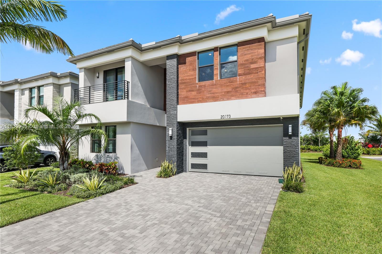 Experience luxury in the sought-after Lotus Palm with this stunning Polynesia model, the largest in the Fiji Collection, on a spacious corner lot with lots of private parking. With 5,506 sq. ft. of living space on a huge 9,540 sq. ft. lot, this home features soaring ceilings, hardwood floors, and large windows filling the space with natural light. The chef's kitchen boasts a quartz island, sleek countertops, and stainless steel appliances, while the primary suite offers dual bathrooms and breathtaking sunset views. Residents enjoy the brand-new Lotus Palm Clubhouse with tennis, pickleball, a restaurant, poolside bar, fitness center, and more. Conveniently near Glades Road, top-rated schools, and Boca's best shopping, dining, and entertainment-don't miss this rare corner lot opportunity!