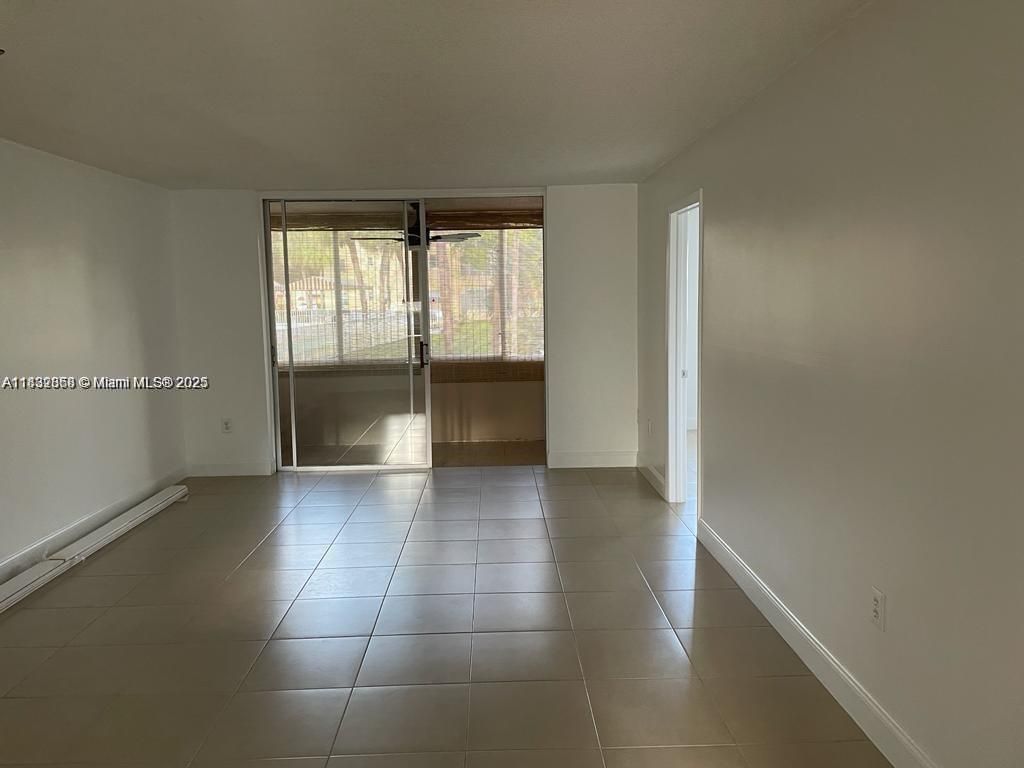 Photo of 8325 Sunrise Lakes Blvd #104, Sunrise, FL 33322 (MLS # A11832868)