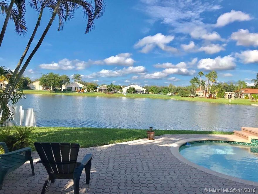 Elegant Pool home with breathtaking Lakeview can be yours today!  Located in the gated community of Pembroke Shores, nestled in the Harborside Estates section, on a large lot with plush landscaping. You will enjoy this “Cancun” floor plan, formerly one of the developers model homes featuring 5 Bedrooms, 2.5 Baths with spectacular views from the Spacious Kitchen, Breakfast nook, Family and Formal Dining room.  You will love the openness of the Foyer and Living room with decorative molding, Volume Ceilings, and oversized windows which allow plenty of natural light. Abundant closets, separate Laundry room with wash tub and 3 car garage.  Impact Windows throughout home, except Glass sliding doors. The community is close to Major highways, Shopping centers and schools. Easy to show call today!