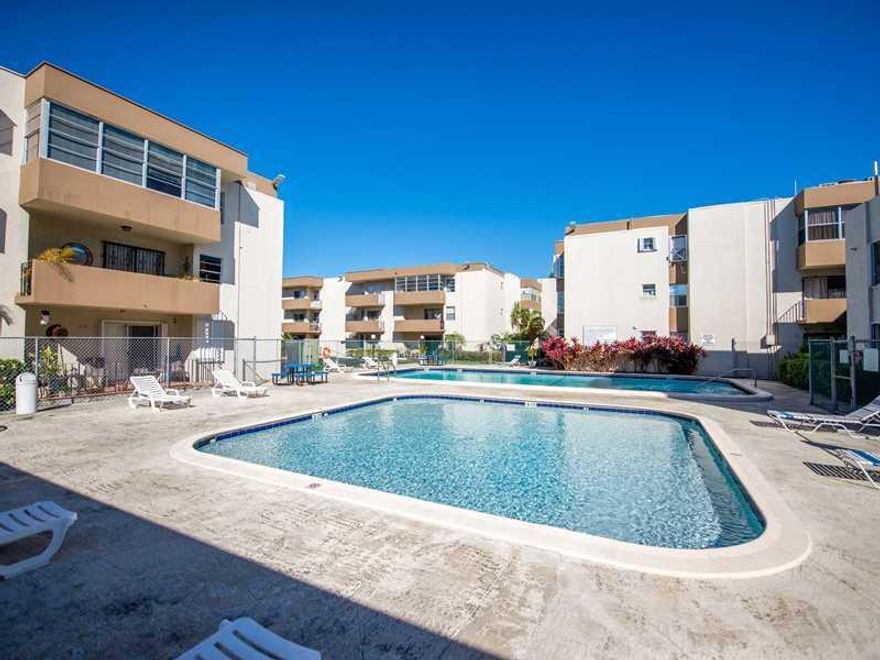 The freshly painted unit is on the first floor of the quiet side of this gated urban oasis. This great location is West of US1 across Coconut Grove. It is conveniently located next to the train station and bus, and  close to downtown, University of Miami , Coconut Grove and Coral Gables. The 2 large pools and the landscaped garden will seduce you. $271 monthly maintenance fees.