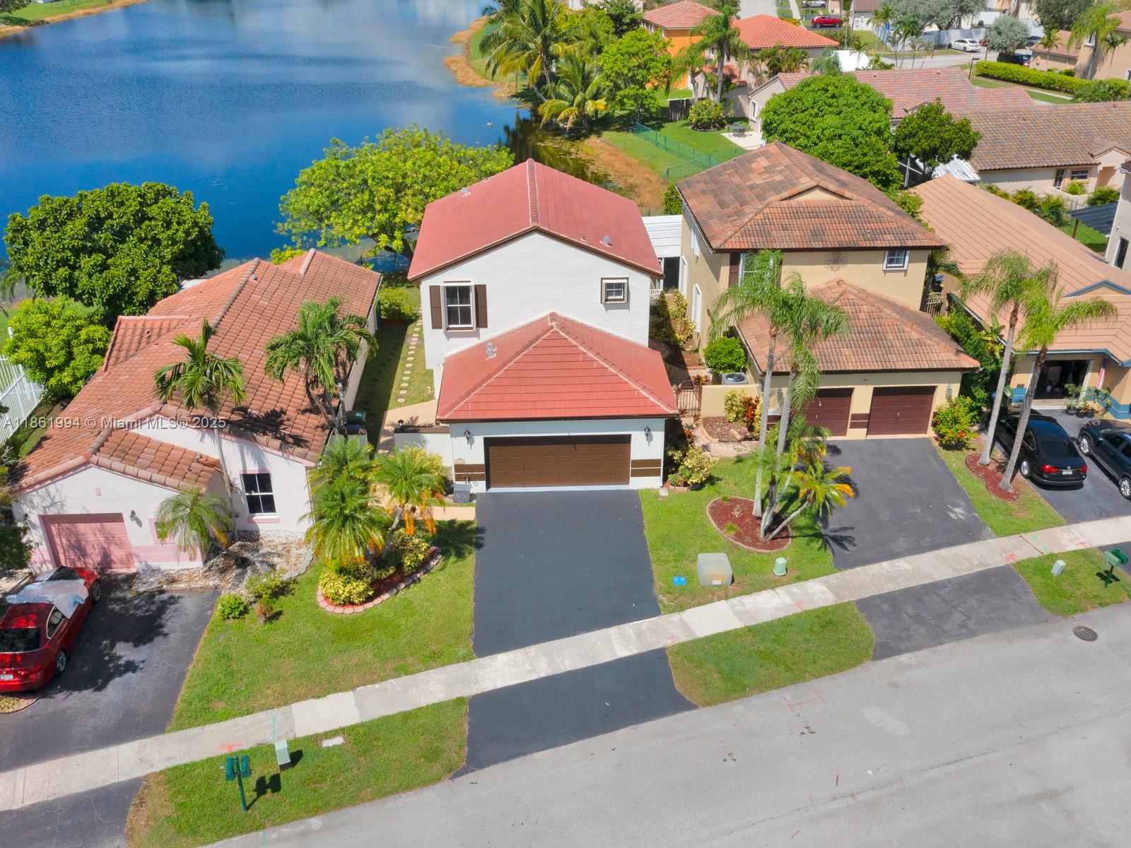 Discover this beautifully UPDATED LAKEFRONT home in the desirable neighborhood at Chapel Trail. Thoughtfully designed for comfort and peace of mind with: Brand NEW ROOF and ACCORDION SHUTTERS on all windows, IMPACT ENTRY DOORS for added security, RENOVATED KITCHEN with quartz countertops, brand-new stainless-steel appliances and pantry. Principal suite on the second floor with his and hers closets, UPDATED BATHROOMS Travertine marble flooring downstairs and laminate flooring upstairs. Step outside to your fenced backyard oasis with a relaxing patio and breathtaking LAKE VIEW, perfect for entertaining Just steps to the community pool and playground, and TOP-RATED SCHOOLS.LOW HOA includes cable TV and internet, Close to shopping, dining, entertainment, major routes, Rose G. Price Park.