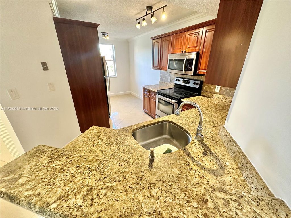 Photo of 8955 Wiles Rd #208, Coral Springs, FL 33067 (MLS # A11825613)