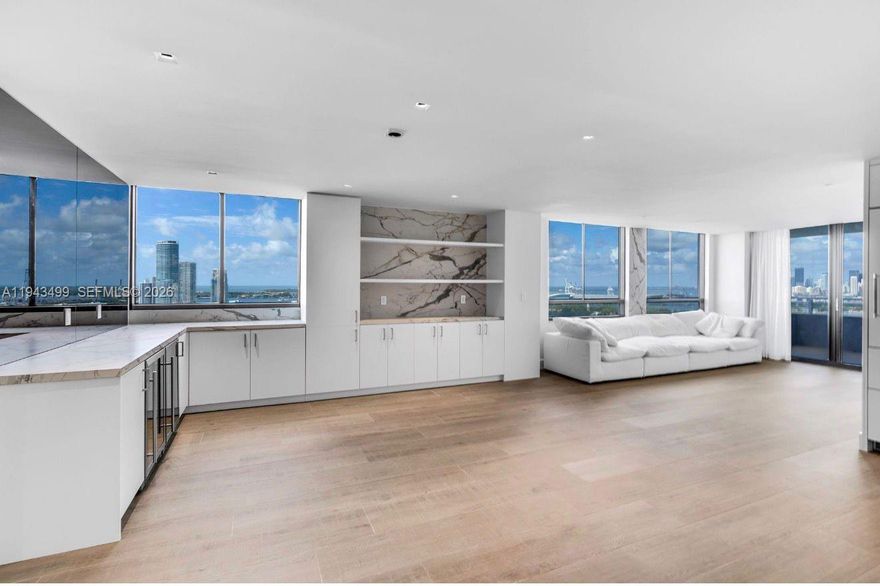 Brand new, turnkey gut renovated unit with direct downtown views at the Waverly South Beach. This is the largest line at the Waverly, huge open living room, wine fridge and 2 beverage centers. Lots of natural light, tons of storage and close space. Enjoy breathtaking sunset views over downtown and the bay, with exposures to the south and west from a high floor that also offers glimpses of the ocean. This exclusive 2-bedroom 2 bath unit includes 2 parking spaces. Tennis and volleyball courts, alongside a pristine pool, add to the allure of this prestigious building. Located a few blocks from Sunset Harbour, this is urban living at its finest.