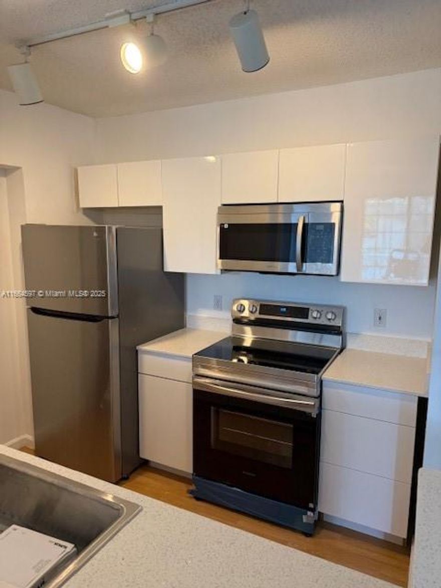 BEAUTIFUL APARTMENT IN VERY DESIRABLE REGENT PARK BUILDING, IN THE HEART OF DOWNTOWN HOLLYWOOD. VERY RARE TO COME AROUND. CLOSE TO ALL RESTAURANTS, CAFES AND ENTERTAINMENT HOLLYWOOD HAS TO OFFER. CLOSE TO THE BEACH AND FT LAUDERDALE AIRPORT. UNIT HAS A FRENCH BALCONY, A NEW WHITE CABINETS OPEN KITCHEN WITH NEVER USED SAMSUNG STAINLESS STEEL APPLIANCES, QUARTZ COUNTERTOPS, WASHER AND DRYER, NEWER A/C. LARGE CLOSET IN THE BEDROOM. UNIT HAS BEEN FRESHLY PAINTED. THE BUILDING OFFERS GREAT AMENITIES SUCH AS SWIMMING POOL, BBQ AREA, GYM, LIBRARY ROOM, SOCIAL EVENT ROOM AND MORE. CAN BE RENTED IMMEDIATELY SO IT IS PERFECT FOR INVESTORS. CAN BE RENTED 4 TIMES/YEAR. EACH UNIT HAS ITS OWN WATER METER. COVERED PARKING IN THE MUNICIPAL GARAGE ON THE 5TH FLOOR, ADJACENT TO THE BUILDING. EASY TO SHOW.
