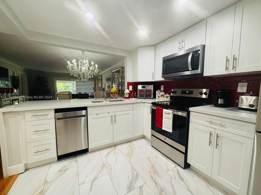 This exquisitely presented in a 55+ community offers luxurious living in a tranquil setting. Spanning 1,364 square feet unit features 3 bd + 2 bth, perfectly designed for comfort and convenience.
Beautiful tile and wood floors throughout. Stunning quartz countertops gives space for cooking and entertaining. Convenient washer-dryer in the unit. This corner unit adds privacy, less noise and more natural light.

Community Amenities: gated community entrance. Social activities at the clubhouse. Professional management on-site.  Five heated pools. Enjoy peaceful moments by the canal, with areas to sit and unwind. Stay connected with internet and cable included in the community services. 

Chandelier not included. 

Unit can be rented.
