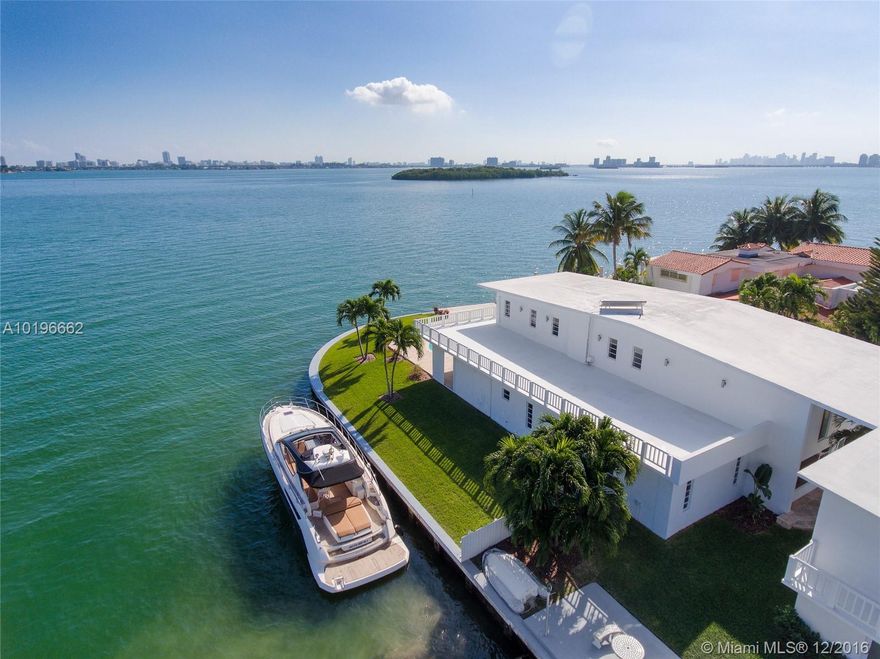 Boaters dream home! Over 200 ft of prime wide bay waterfront. Offering stunning views of everything from Indian Creek Island to Downtown Miami. Gorgeous, sun flooded home with wide stripped oak wood flooring, double height ceilings, x-large bedrooms and lots of upgrades. Sitting on an oversized 20,000sqft lot and even a private Guest house on property as well as a 2 Car garage. No fixed bridges. Guard gated neighborhood. 5 min drive from world renown Bal Harbour shops.