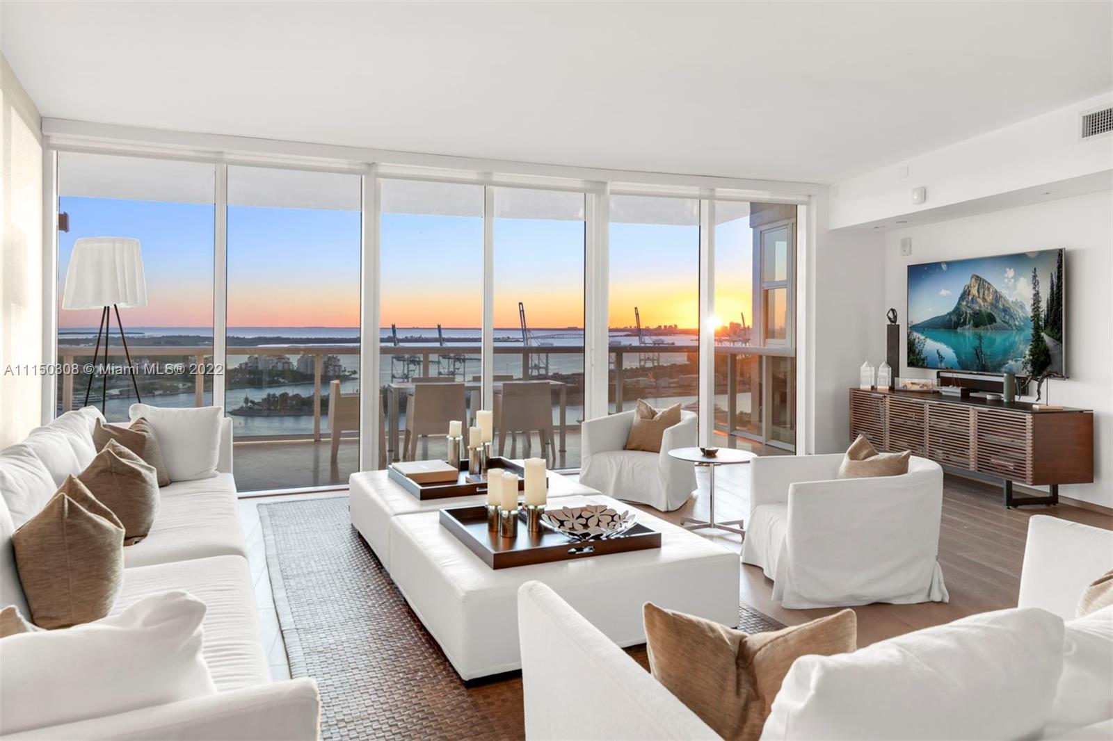 Enjoy panoramic views of the bay, ocean and the sparkling Miami skyline all while experiencing sunrises and sunsets from your home in the sky in the coveted South of Fifth. This spacious flow-through floorplan boasts two east and west terraces offering spectacular views from a rare high floor flow through floor plan. Enter through your own private elevator foyer to a fully renovated 3 bedrooms, 3 full bathroom and 1 half bathroom 3,059 square foot residence. Features include wood floors, gourmet kitchen with top-of-the-line appliances, SubZero wine cooler, floor-to-ceiling windows and views from every room. Murano Grande offers resort style amenities with a state-of-the-art fitness center and spa, pool, tennis court, restaurant, concierge, valet parking and 24-hour security.