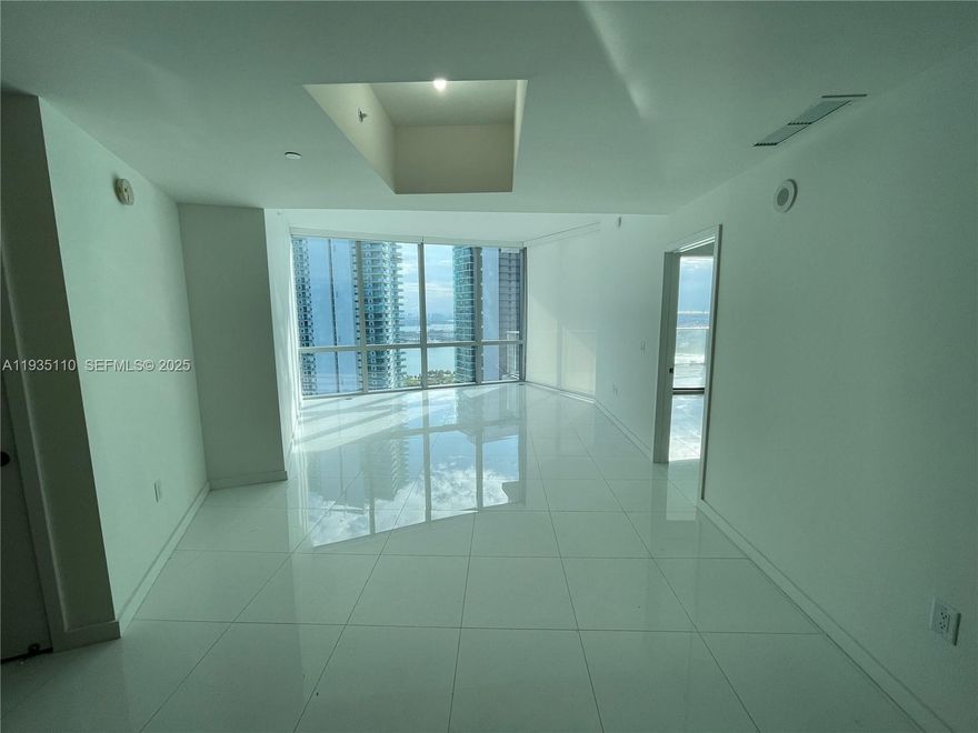 This stunning 2-bedroom, 3-bath luxury unit at Paramount Miami World Center offers an exceptional living experience. Featuring a private elevator, white ceramic floors throughout, and an oversized balcony with breathtaking sunset views of Miami, this home is truly one-of-a-kind. Enjoy built-out closets, blinds on all windows, and the convenience of 2 parking spots (1 valet & 1 assigned). The building boasts the world’s most amenities, including 5 pools, a spa, gym, basketball court, yoga studio, recording studio, racquetball, and more. With internet and cable included, this condo is perfect for both living and renting out. Don’t miss out on this incredible opportunity!----------UNIT RENTED TILL 1/31/2026, paying $6,700.00 PER MONTH - 24hs previous notice in advance at least to show