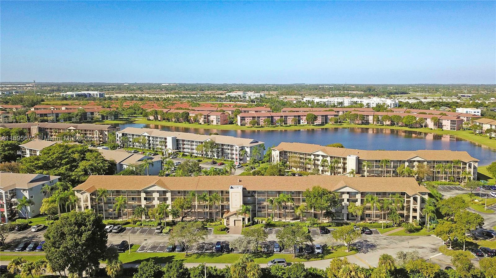 HIGHLY DESIRABLE 1ST FLOOR CORNER UNIT in the beautiful golf club community of Century Village. Freshly painted, great privacy, walk-in closets, Beautiful kitchen with newer appliances, accordion shutters, washer & dryer in unit and Great size screened porch. 55+ Community with resort style amenities, club house with indoor activities, 1,030 seating Theater, 71 par golf course, BBQ area, Fishing, walking paths, tennis/pickle ball courts, shuffleboard, Bocce Ball, butterfly garden, health & fitness center, and multiple pools. Nearby access to I-75, located closely to great shopping, entertainment, recreational parks, hospitals, Medical clinics & Pharmacies. FREE community shuttle bus transportation. Association fee covers multiple amenities, water, sewer, trash, basic cable & wifi.