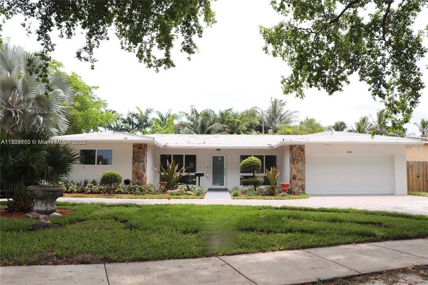 This beautifully modernized home sits on a generous 11,500+ sq ft corner lot in a desirable Hollywood neighborhood, just minutes from Temple Sinai, Memorial Regional Hospital, major highways, shopping centers, and dining options. The home boasts elegant hardwood flooring throughout, with luxurious marble and porcelain finishes in the kitchen and bathrooms. Enjoy the outdoors in your private, fenced-in backyard complete with fruit trees, an open patio, and a concrete slab ideal for RV or boat parking. Additional highlights include a spacious Florida room, a two-car garage, impact windows, a brand-new roof, and countless other upgrades that make this home truly move-in ready.
