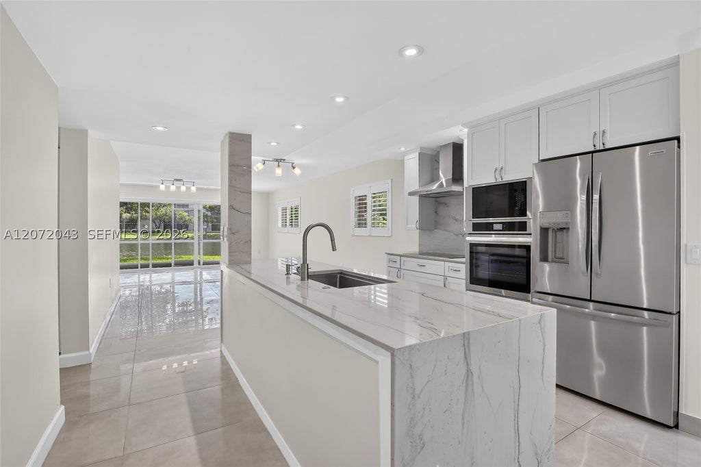 Photo of 13800 SW 14th St #114C, Pembroke Pines, FL 33027 (MLS # A12072043)