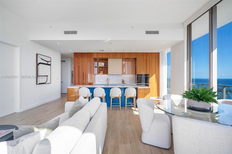 Rare high-floor corner residence in the Bayshore Building at Mr. C Residences Coconut Grove, featuring panoramic bay and skyline views from a spacious wraparound terrace. Located on the 19th floor, this light-filled 3BR/3.5BA home offers 11+ foot soaring ceilings, multiple exposures, and seamless indoor-outdoor living.

Interiors include bespoke Mr. C signature cherry wood cabinetry with blue and brass hardware, a chef’s kitchen with Italian cabinetry, terrazzo and quartz surfaces, and Sub-Zero/Wolf appliances. Spa-inspired baths feature penny tile detailing, custom vanities, and glass-enclosed showers.

Includes 2 valet parking spaces and a private oversized storage room—an uncommon upgrade. Residents enjoy resort-style amenities including a private pool with poolside service, state-of-the-art fitness center, wellness facilities, and on-site dining at Le Specialita Café & Market.

Prime Coconut Grove location with walkability to Fresh Market, Starbucks, parks, retail, dining, local schools, clubs, and marinas, plus convenient access to Brickell, Downtown, and MIA.

1,603 sq ft per Developer "Unit Area" measurement and 1,779 sq ft per Developer "Typical Area" measurement as recorded in Declaration of Condominium document.