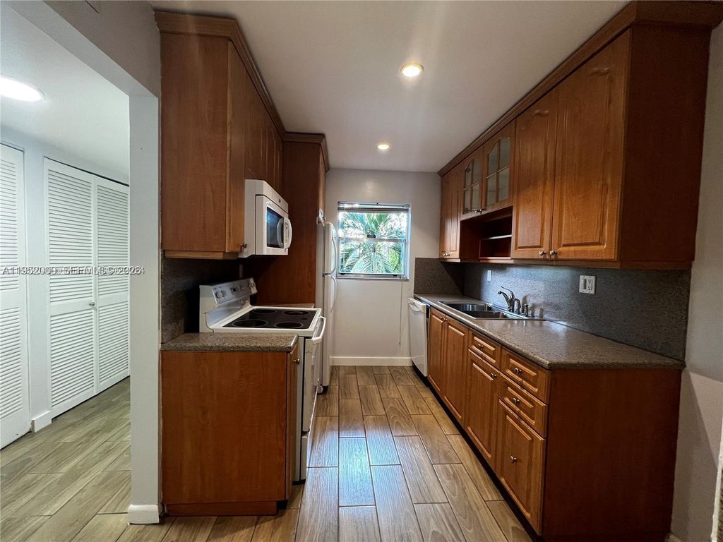 Photo of 4111 Stirling Rd #308, Dania Beach, FL 33314 (MLS # A11952000)