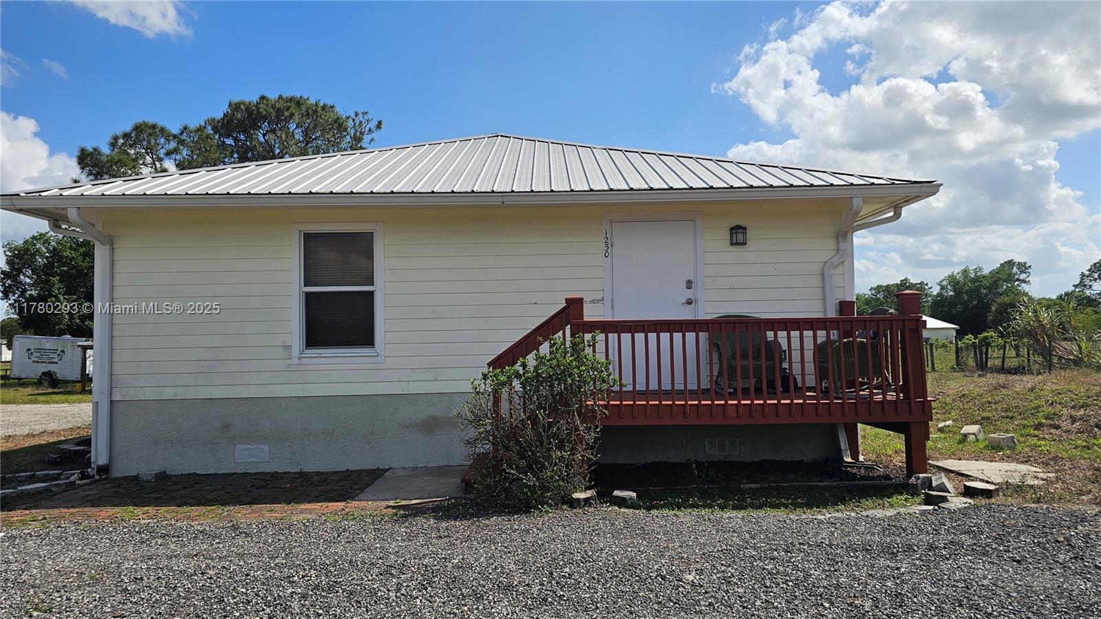 Escape to your own private retreat! This charming 1-bedroom, 1-bath elevated home sits on 2.5 acres of cleared land in the heart of Pioneer Plantation. Built in 2008, this well maintained property features a metal roof, wood siding, spacious layout, and peaceful surroundings, perfect for those seeking quiet country living or a weekend getaway. The interior includes a large open kitchen with modern tile flooring and natural wood ceilings, offering warmth and character. Zoned residential rural (RR) with plenty of space for animals, equipment, or future expansion. No HOA. Whether you’re looking to live off the grid, start a homestead, or simply enjoy wide open space, this is it!