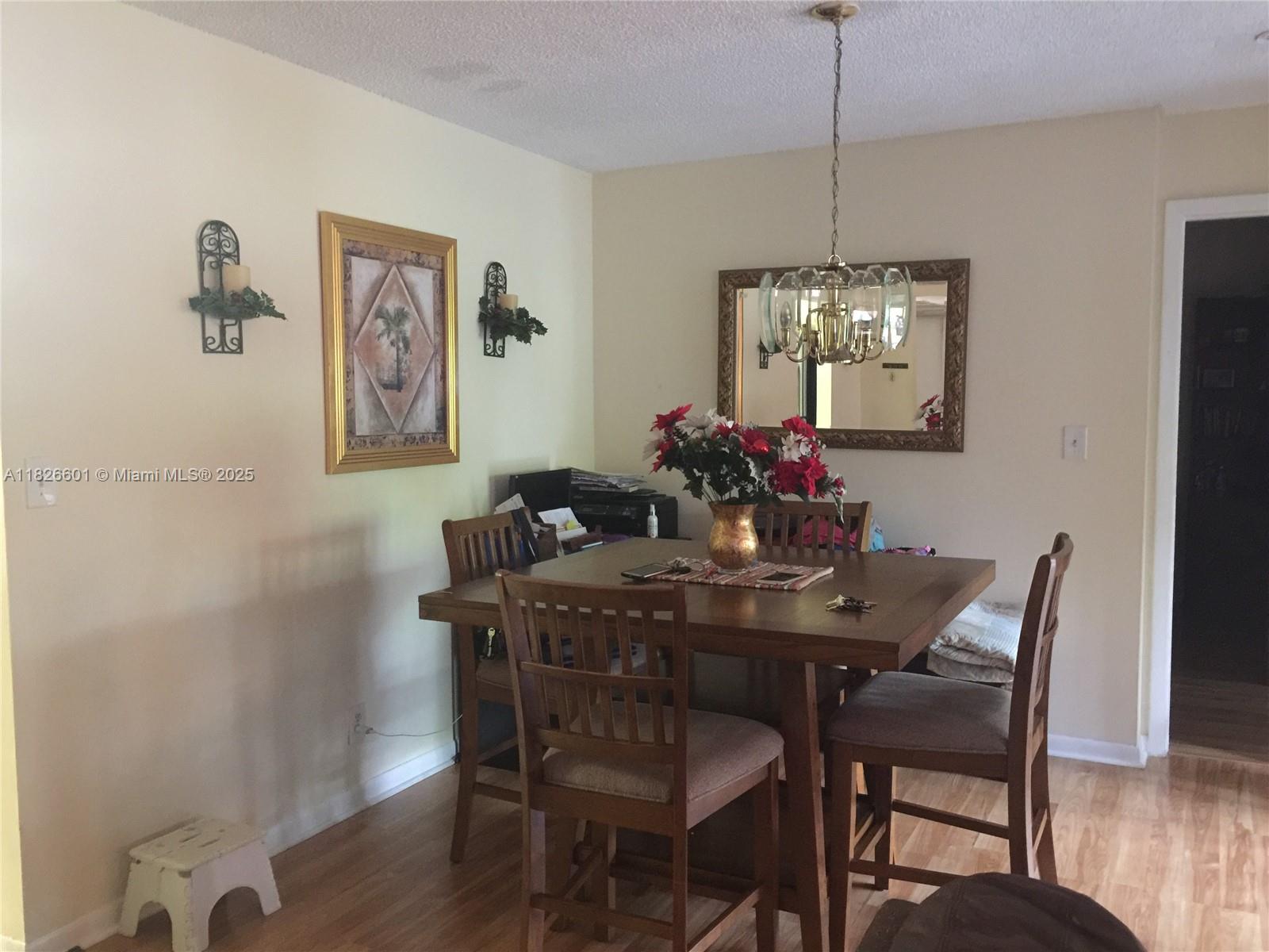 Recently upgraded 2/2 condo with Stainless Steel kitchen appliances, upgraded bathrooms, and wooden flooring. Well laid out with lots of closet space (walk-in closet in master). Updated bathrooms. Updated kitchen, which is large enough for a breakfast nook. Full-sized washer & dryer in utility area off the large screened patio that overlooks the garden. All age community with clubhouse pools, tennis, pickleball, basketball courts, gym, playgroundv Credit score 650+, Rentspree, community interview. Walking distance to the Community Pool. Well-kept development. Close to Trade Winds Park. This deal includes cable & water!